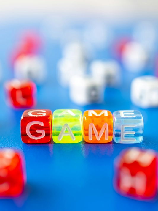 red white yellow and blue plastic dice